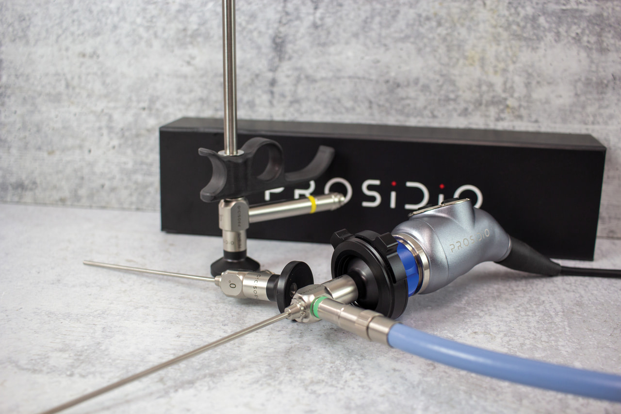 Rigid endoscopes and camera head displayed on a work surface